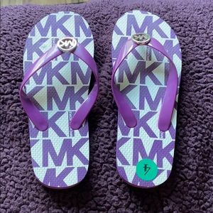 Purple Michael Korda sandles.